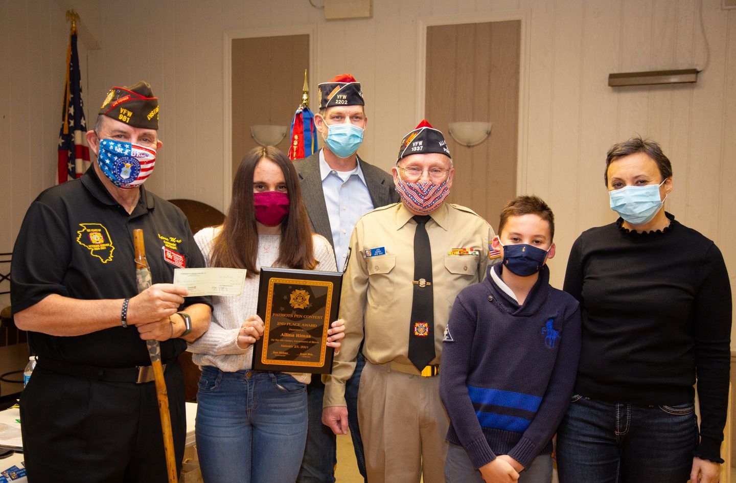 District 4 Commander Steve MacInnes and PP Chairman Joe Wein  presents Alina Rimas and award for winning the patriot Pen contest at the district level.